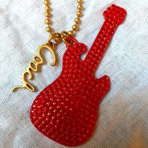 Coach long chain guitar necklace